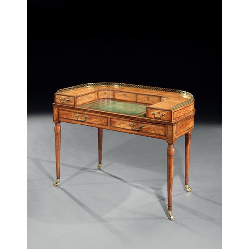 A George III small satinwood Carlton house writing table attributed to Gillows
